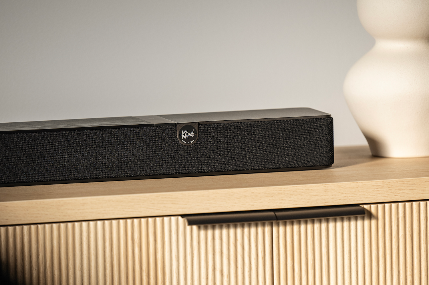 Klipsch Flexus Core 200 on Modern Media Console Beside Vase 2000x1333