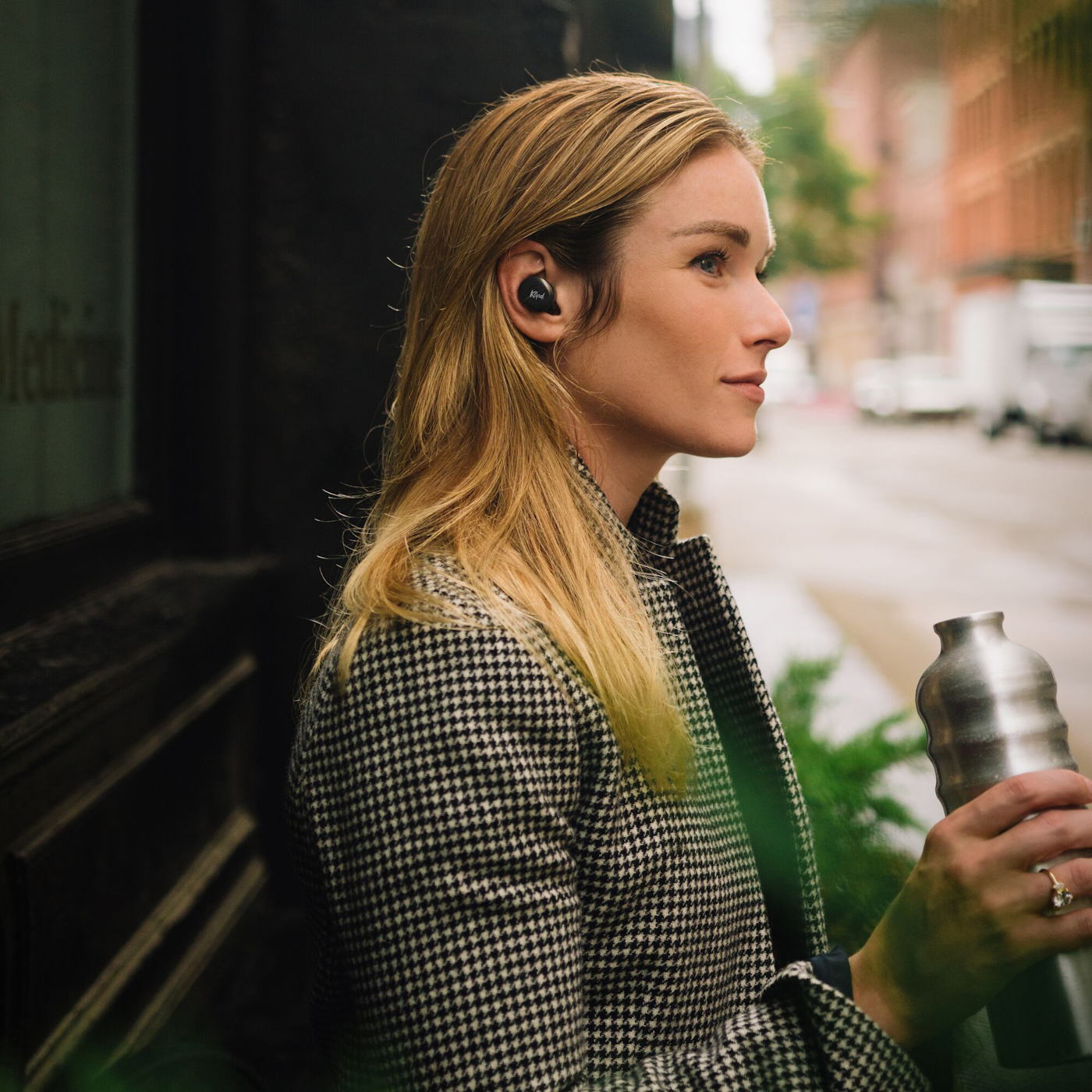 Klipsch T5 II active noise canceling earbuds woman outside building 1