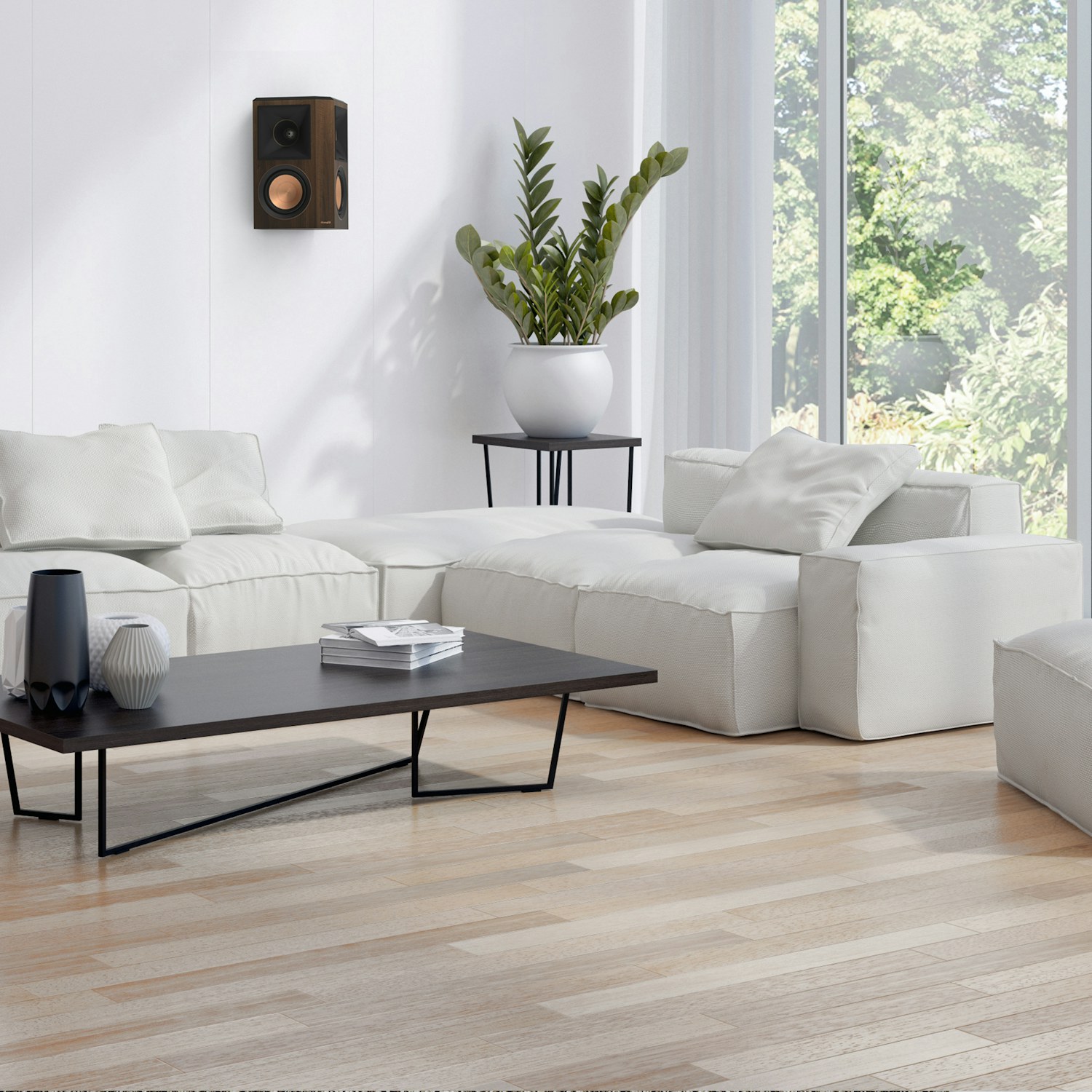 RP 502 S II surround speaker in walnut finish hung on a white wall near a living rooms corner mobile