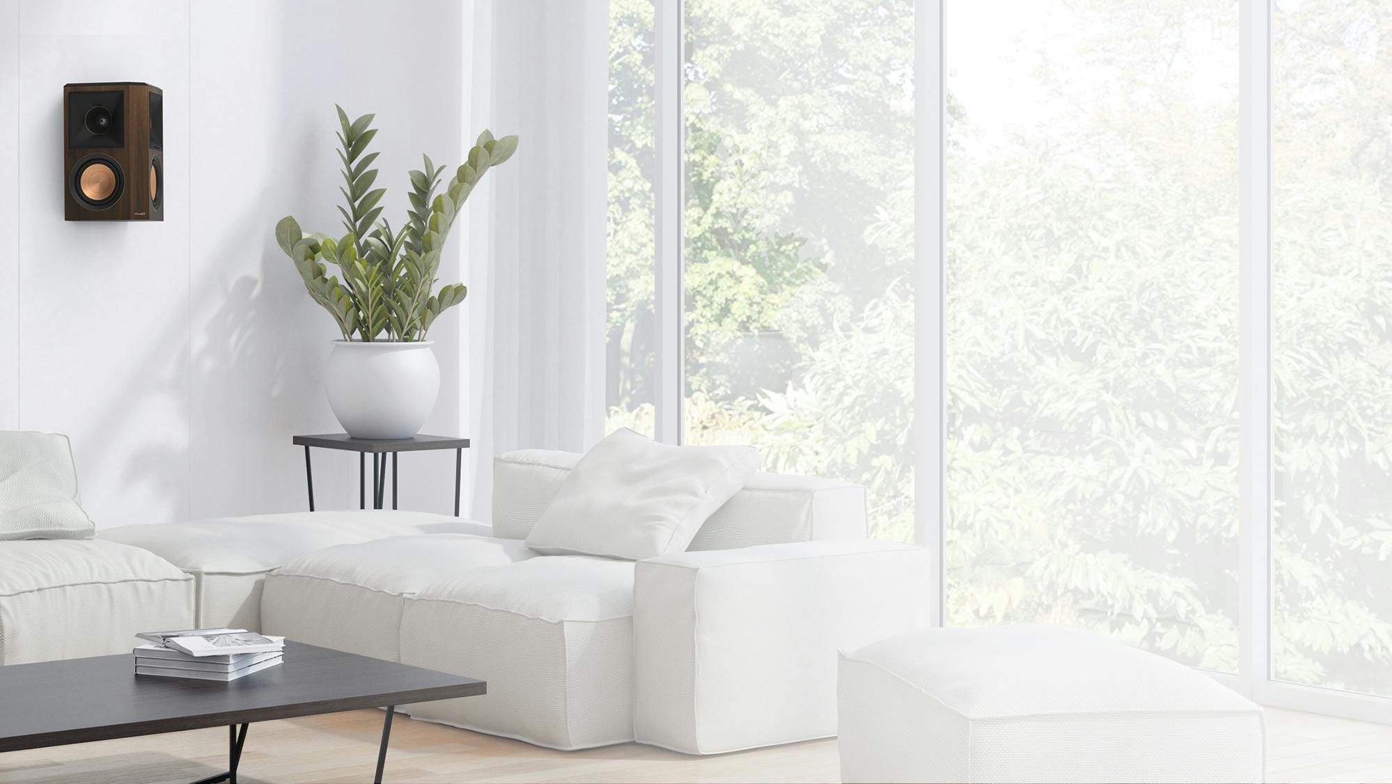 RP 502 S II surround speaker in walnut finish hung on a white wall near a living rooms corner